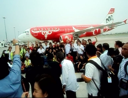Carabao pose for the press in front of the specially painted plane